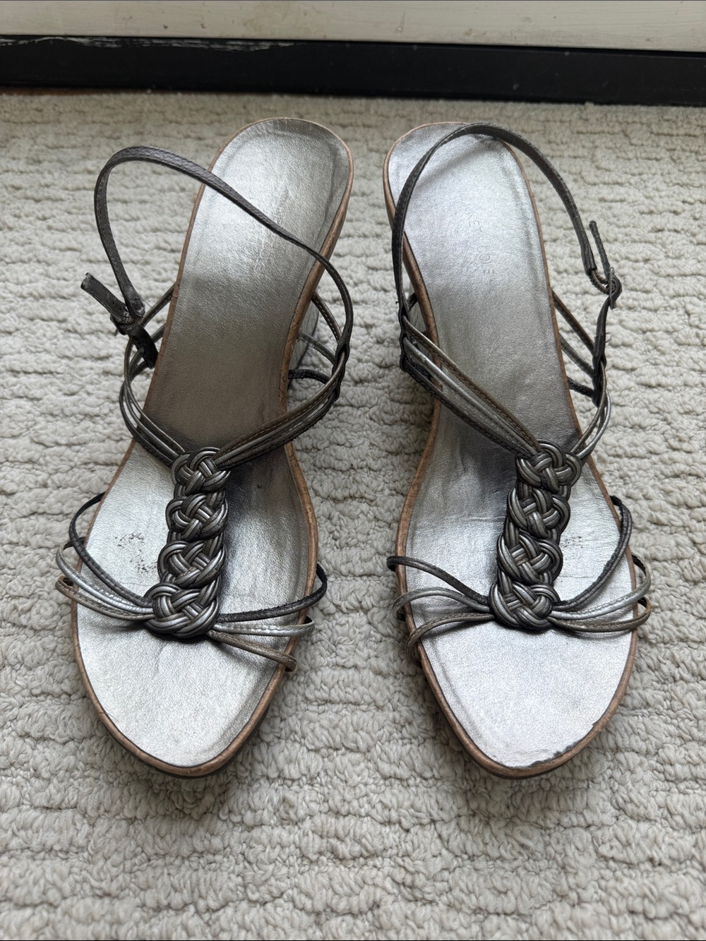 Kenneth Cole Reaction silver goddess wedge sandals featuring a braided T-strap d
